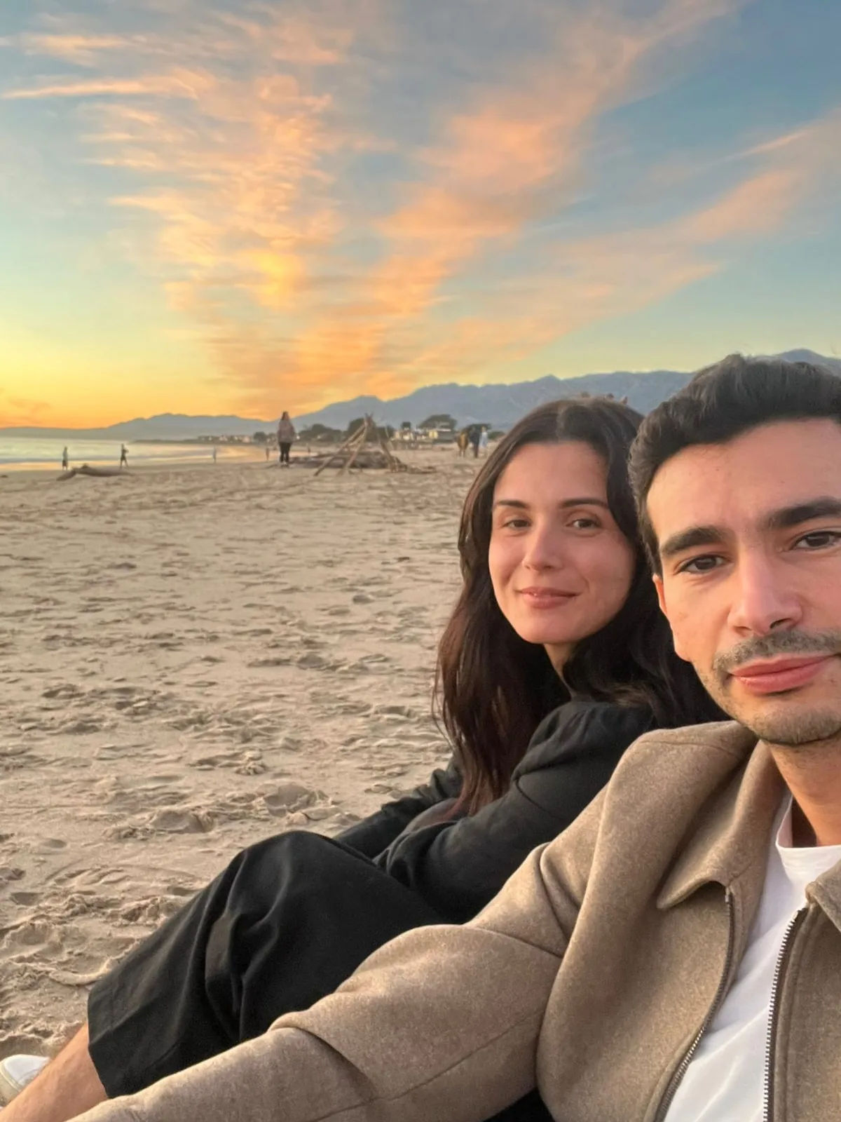 Stef and Mehdi on the beach at sunset in Santa Barbara